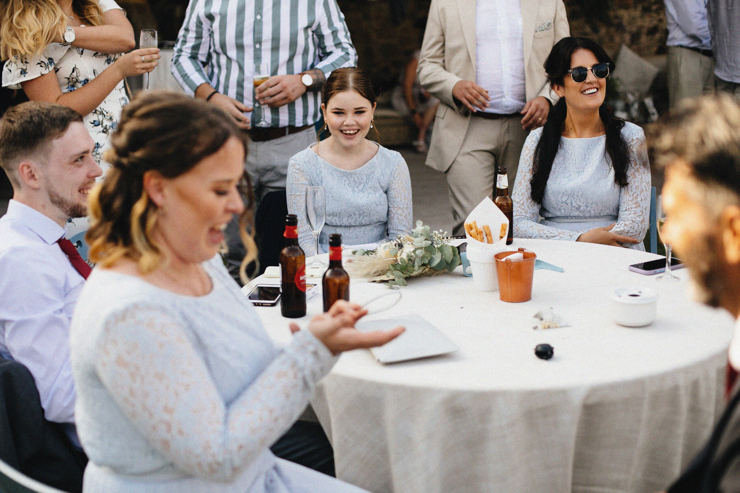 Wedding guests watching close-up magic