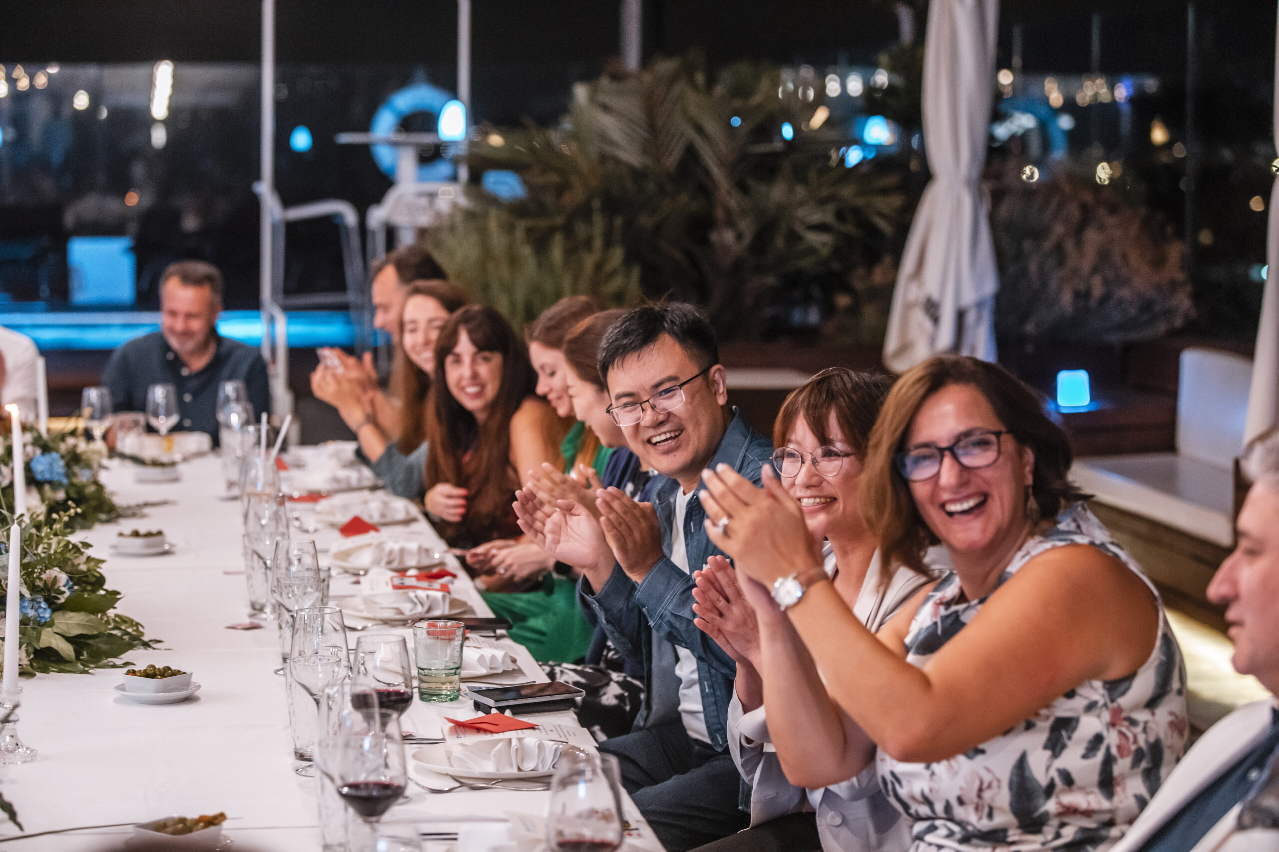 Guests enjoying close-up magic at a private event