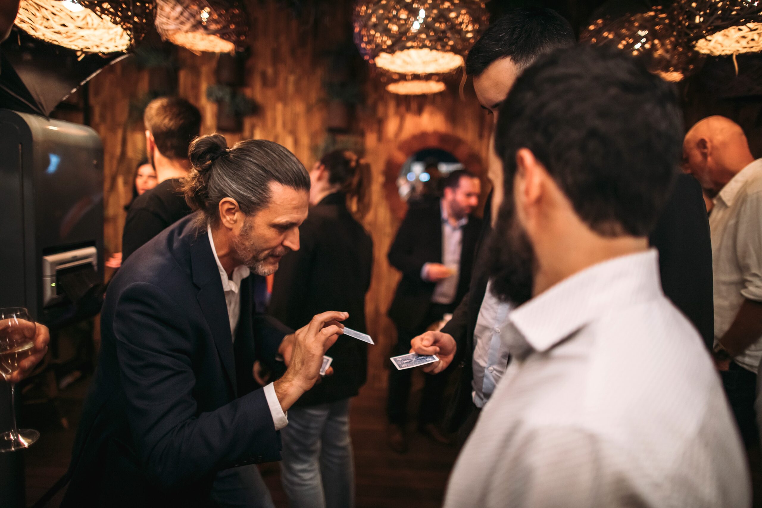 Sieko performing strolling magic at a private event