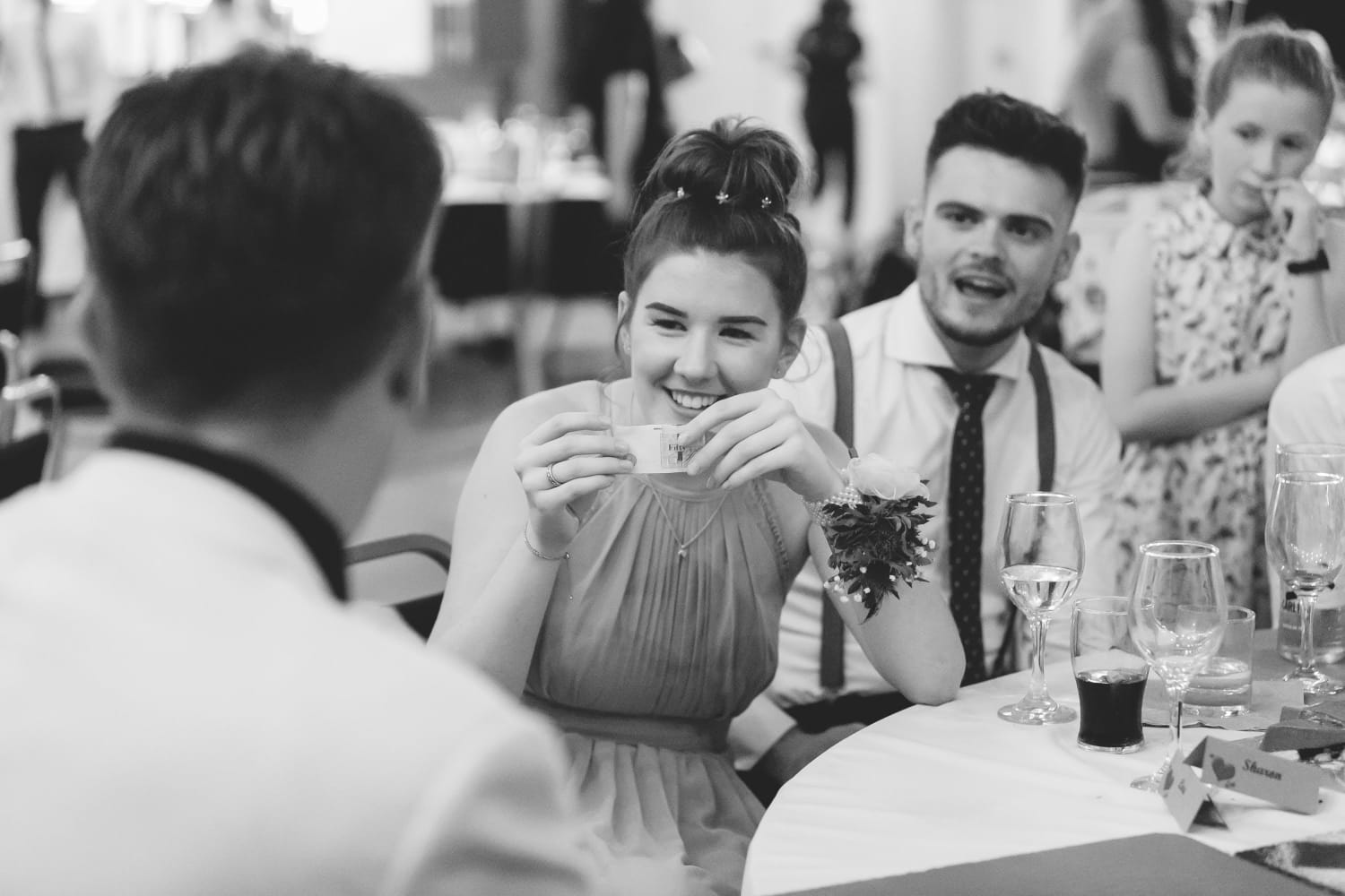 Guests reacting to Sieko performing close-up magic